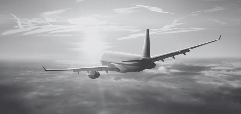 Avión volando por los aires como representación de la la internacionalización sostenible de las empresas